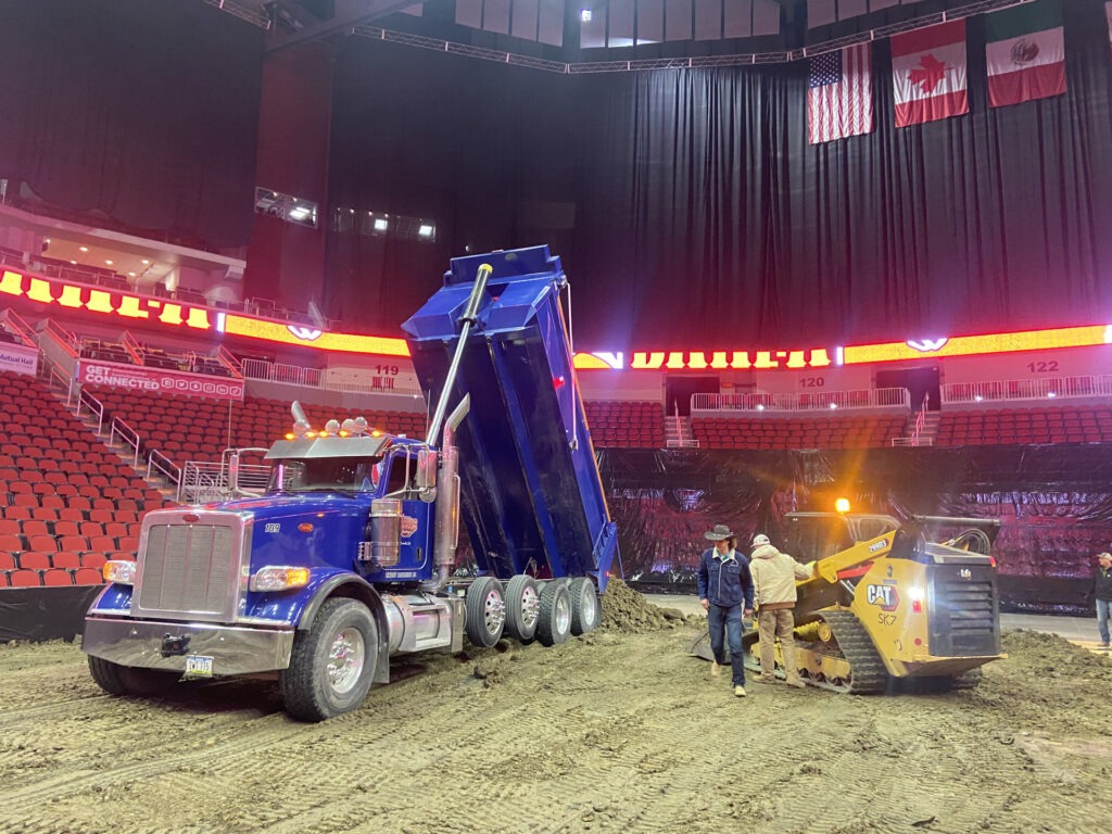 Dump truck and skid loader at Wells Fargo Arena
