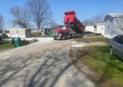 Dump truck spreading gravel